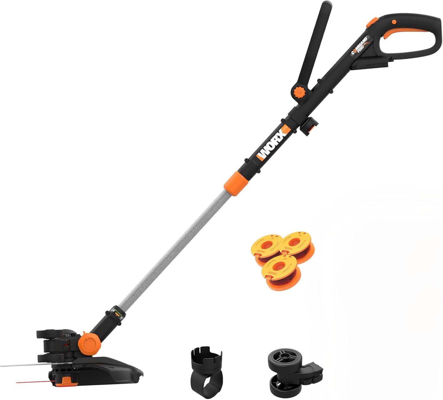 String trimmer resting on freshly cut grass