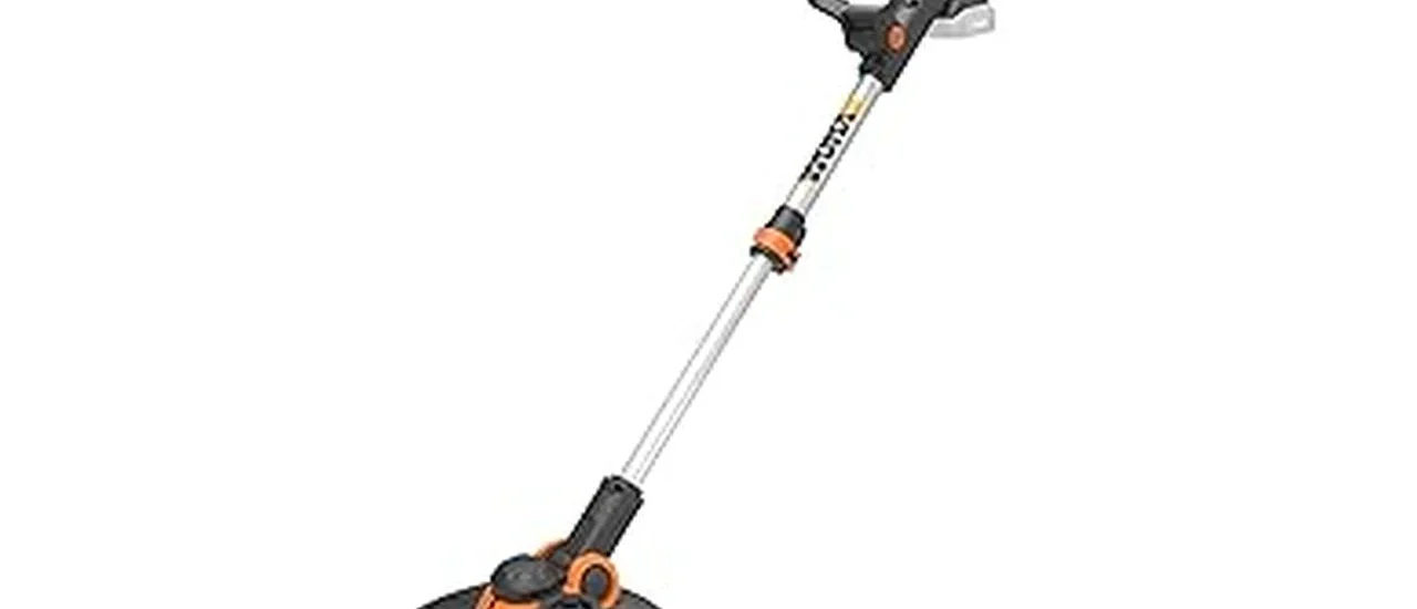 This image shows a person neatly trimming a lawn edge with a powerful electric edger.
