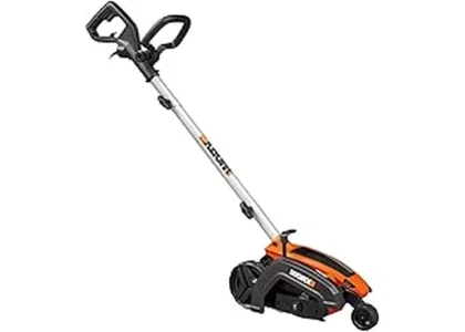 The image shows a person using a powerful electric lawn edger to create a clean border.