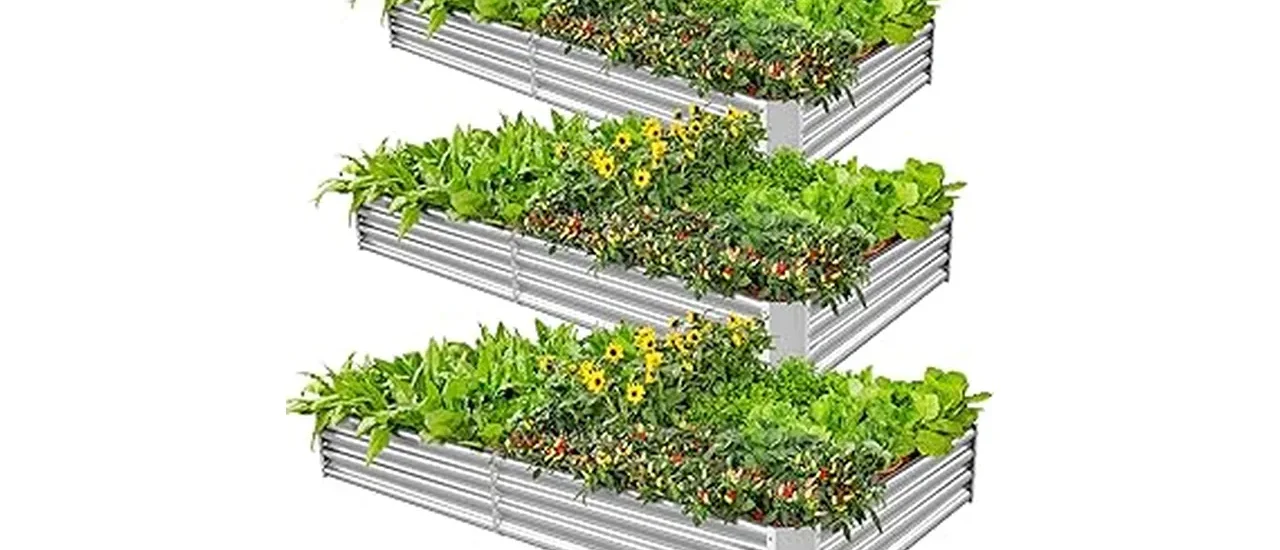 The image shows several attractive metal raised garden beds filled with healthy plants.