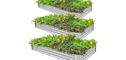 The image shows several attractive metal raised garden beds filled with healthy plants.