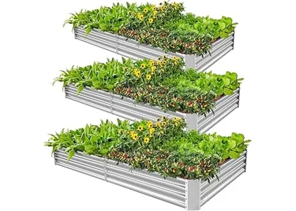 The image shows several attractive metal raised garden beds filled with healthy plants.