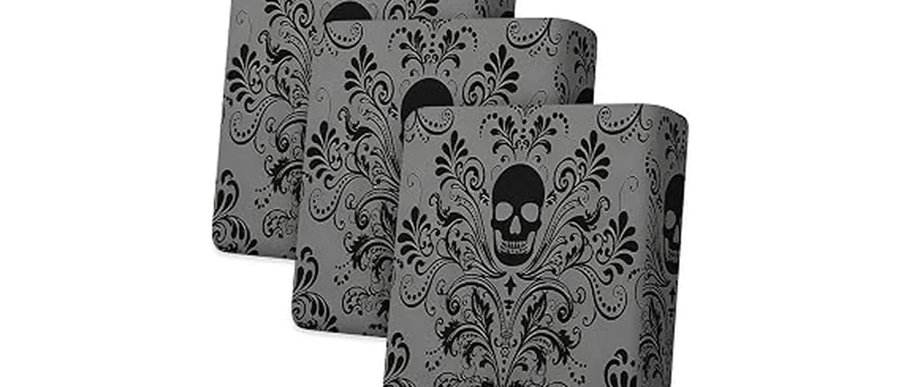 The image shows a vibrantly decorated outdoor patio with spooky Halloween-themed cushions.