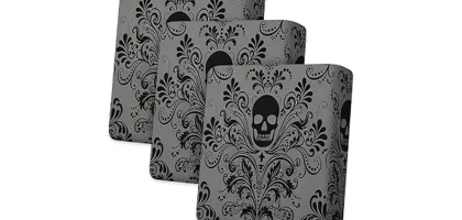 The image shows a vibrantly decorated outdoor patio with spooky Halloween-themed cushions.