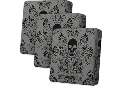 The image shows a vibrantly decorated outdoor patio with spooky Halloween-themed cushions.