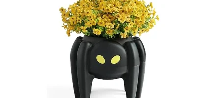 The image shows several ornate gothic planters suitable for Halloween porch decor.