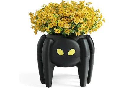 The image shows several ornate gothic planters suitable for Halloween porch decor.