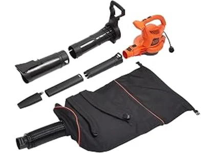The image shows a person using a backpack leaf blower to clear leaves from a large yard.