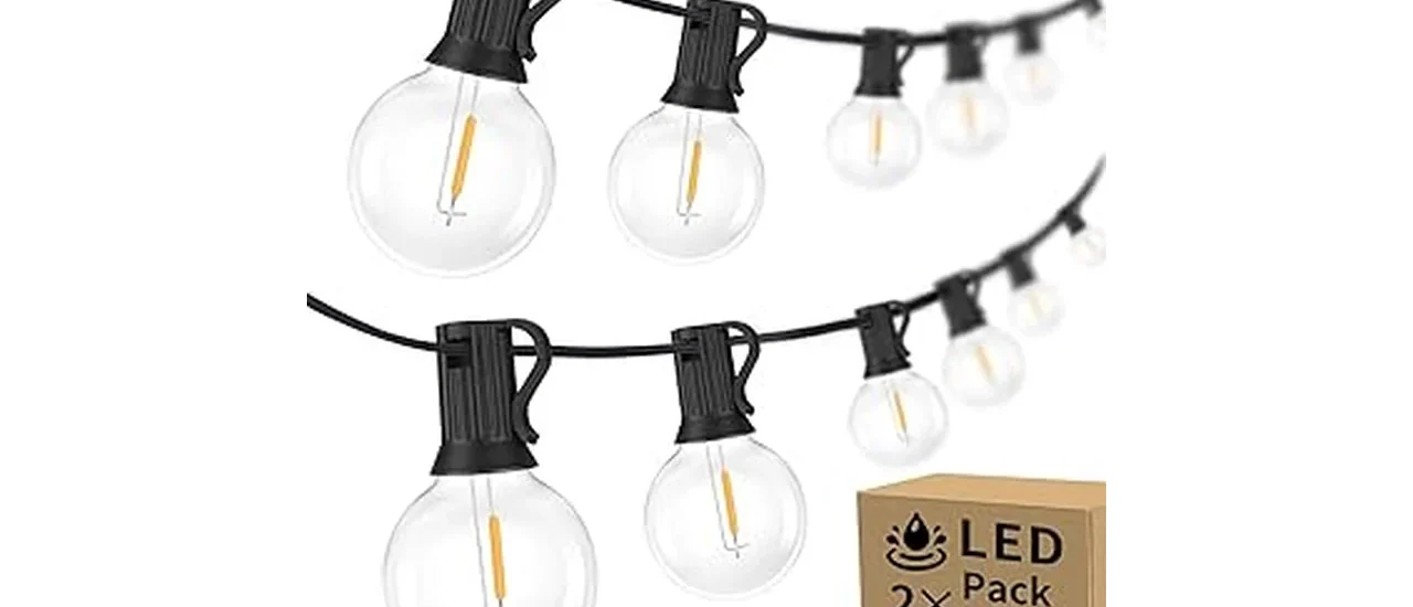The image shows a string of commercial grade outdoor lights creating a warm ambiance for an event.