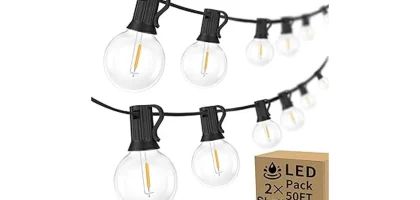 The image shows a string of commercial grade outdoor lights creating a warm ambiance for an event.