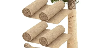 The image shows a collection of burlap plant wraps bundled together, ready to protect plants.
