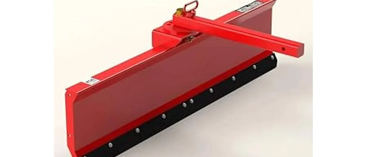 The image shows a lawn tractor equipped with a snow plow attachment clearing snow.