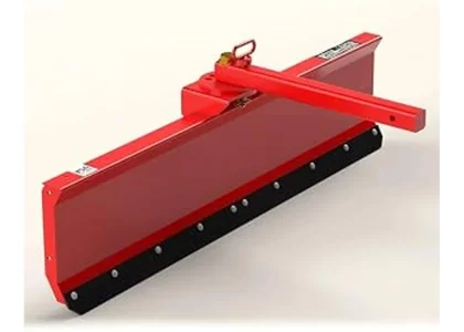 The image shows a lawn tractor equipped with a snow plow attachment clearing snow.