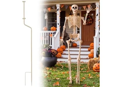 The image shows a spooky skeleton decoration in a yard, part of the Most Popular 10 Outdoor Skeleton Decorations for Halloween.
