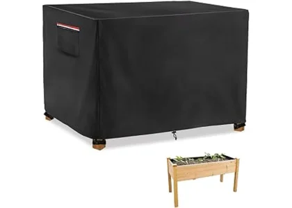 The image shows a raised garden bed covered with a protective winter cover, ideal for keeping plants safe.