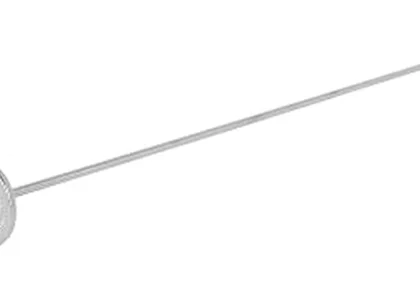 The image shows a close-up of a soil temperature probe inserted into dark earth.