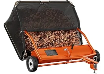 The image shows a tow-behind lawn sweeper collecting grass clippings for a large yard.