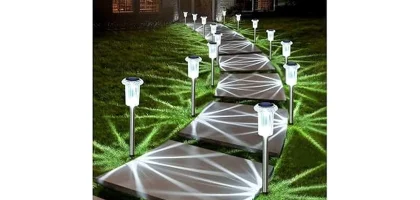 The image shows a garden path illuminated by the most popular 7 solar pathway lights, shining brightly outdoors and waterproof.
