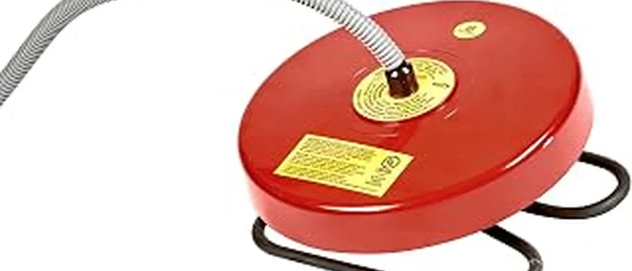 The image shows a floating stock tank deicer heating water for livestock.
