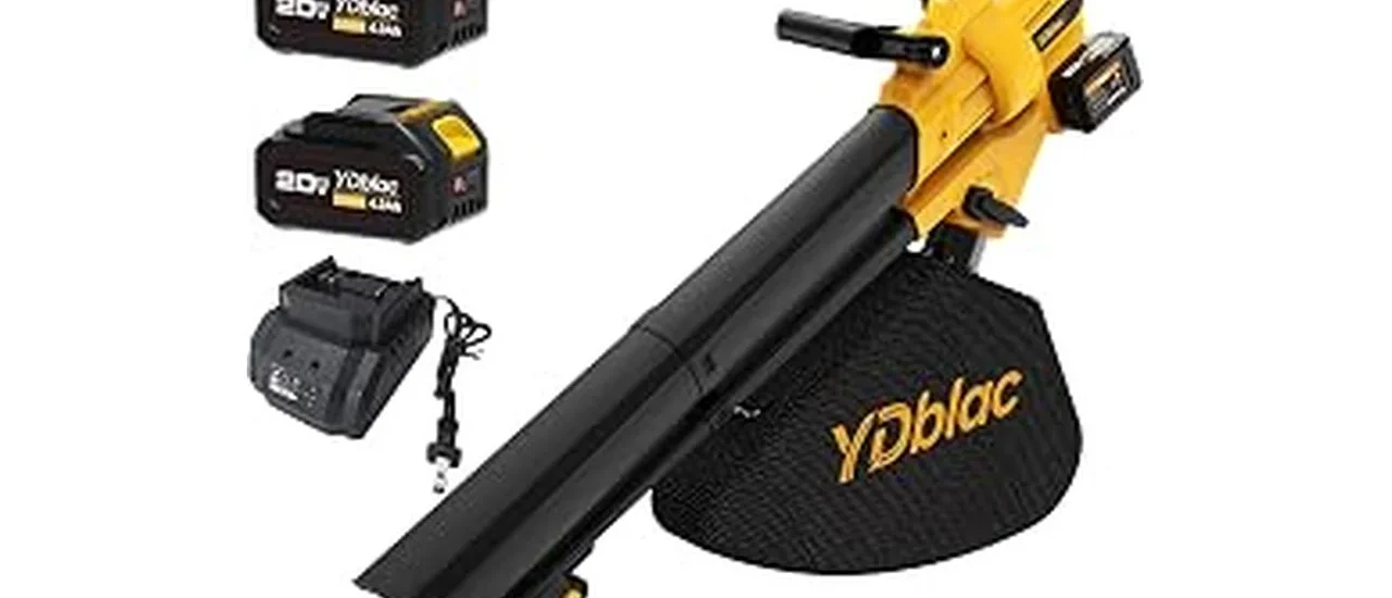 The image shows a powerful leaf vacuum mulcher efficiently clearing debris from a spacious lawn.