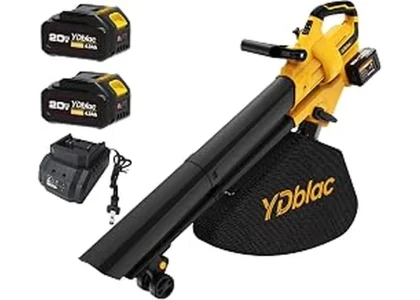 The image shows a powerful leaf vacuum mulcher efficiently clearing debris from a spacious lawn.