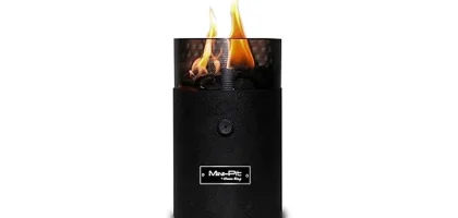 The image shows seven stylish tabletop propane fire bowls for outdoor gatherings.
